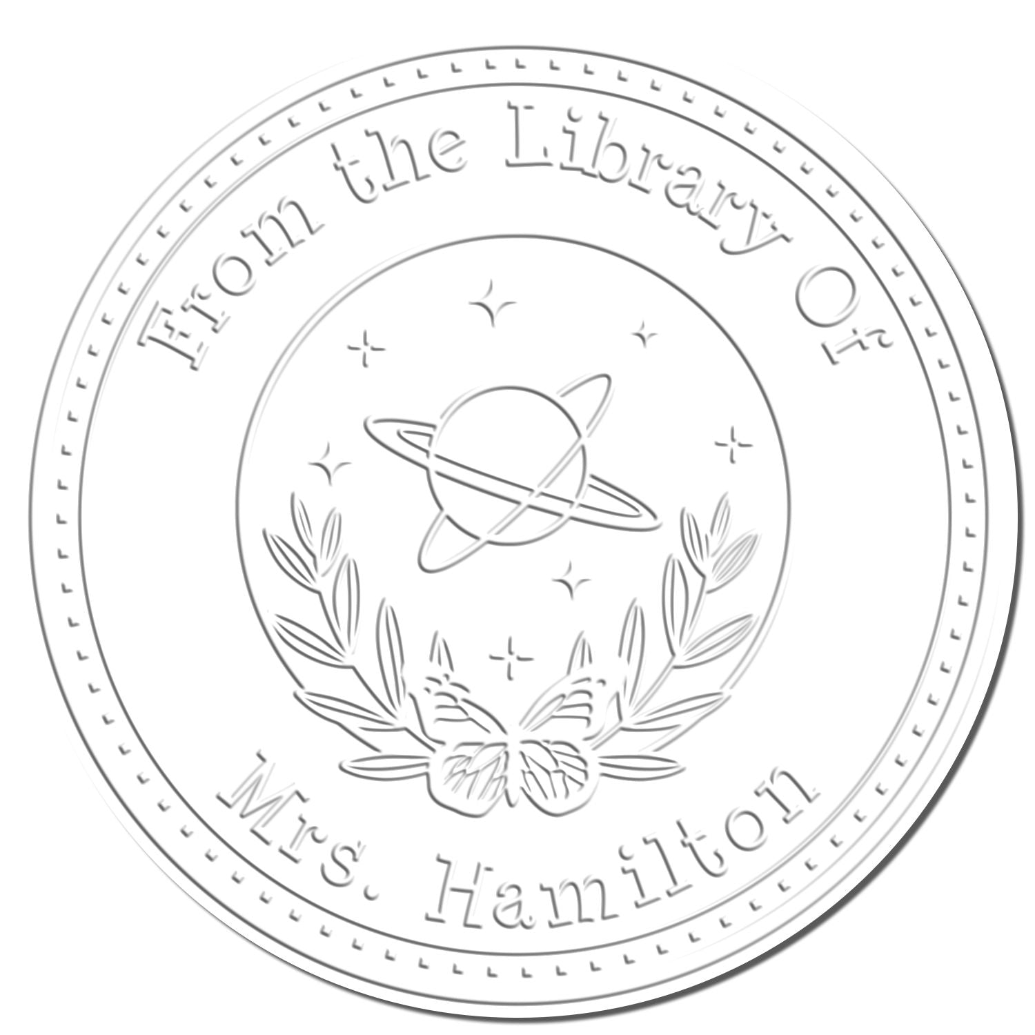 Silver circular library stamp seal with planet and laurel design, reading From the Library of Mrs. Hamilton.