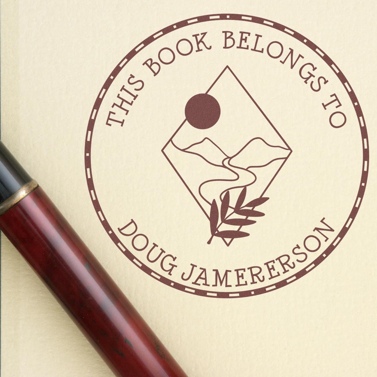 Maroon custom bookplate stamp and seal reading This Book Belongs to Doug Jamerson on beige paper with red-brown handle.