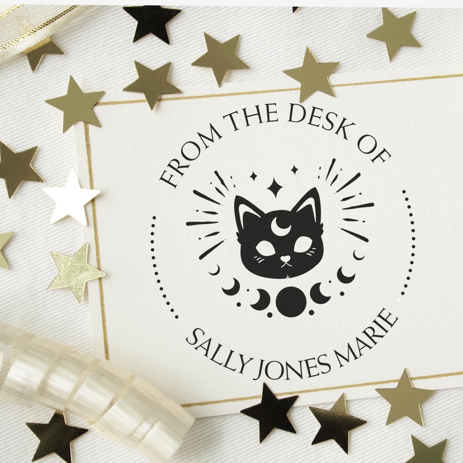 Personalized stamp seal with black moon cat logo, gold border, and gold-and-black stars on white, reading Sally Jones Marie