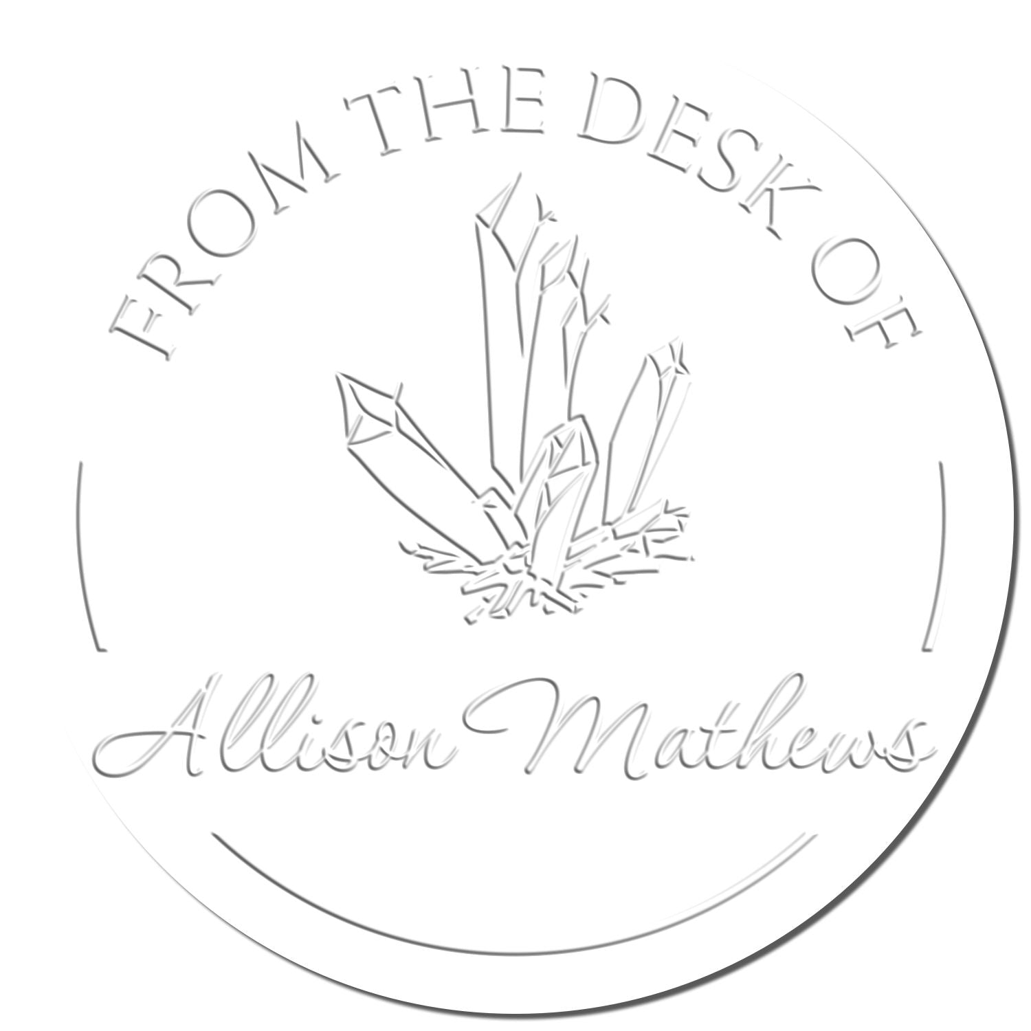 White circular embossing seal stamp with crystal graphic and gray text reading From the Desk of Allison Mathews.