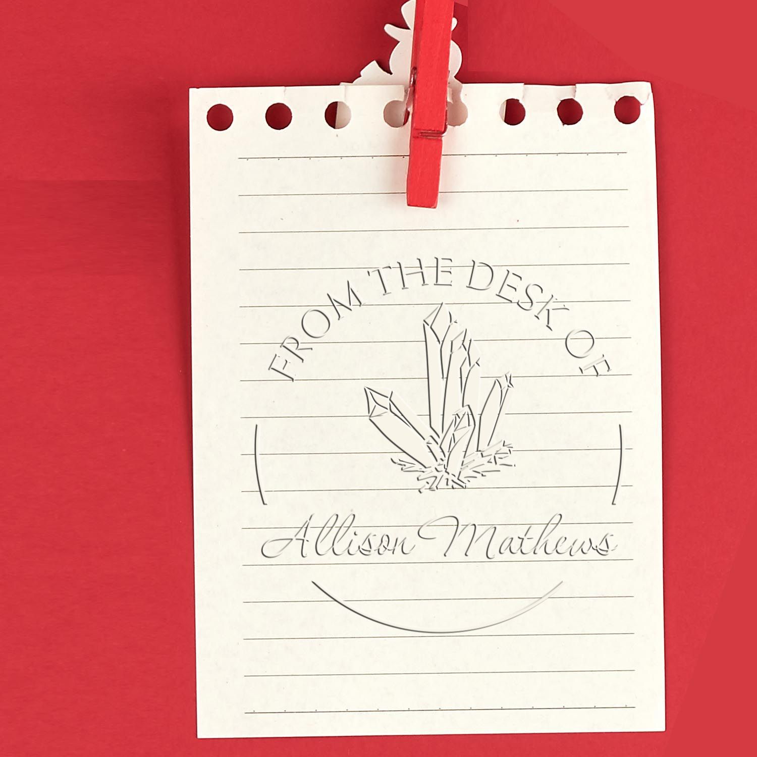 White custom stamp and seal sheet clipped with a red clothespin on a red background, featuring a crystal logo and Allison Mathews text.