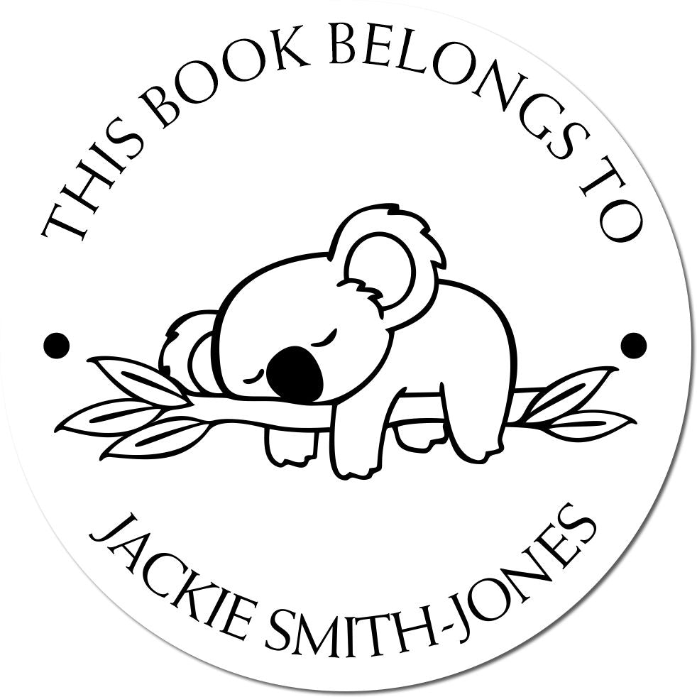 Round black-and-white book stamp with sleeping koala on branch and This book belongs to Jackie Smith-Jones text.