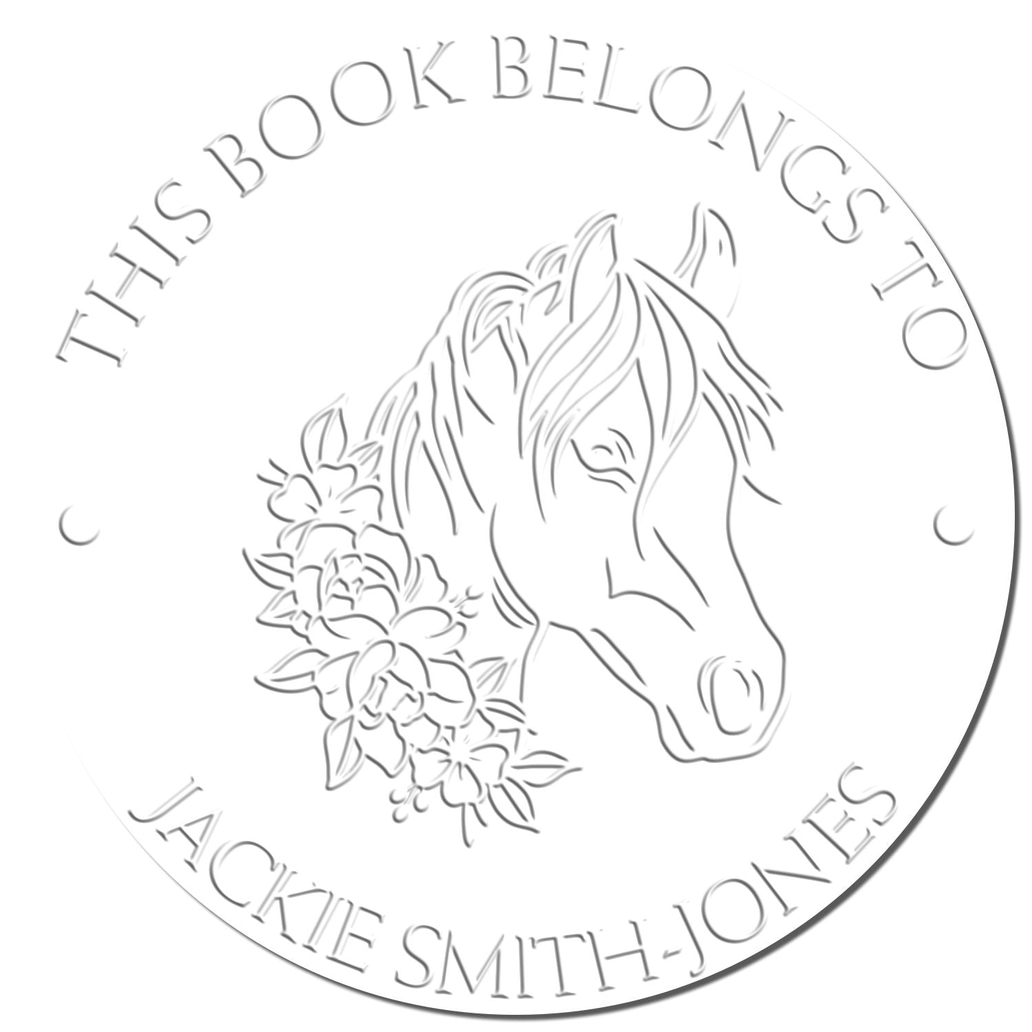 Circular white embossed book ownership stamp seal with horse and flowers, reading This Book Belongs to Jackie Smith-Jones.