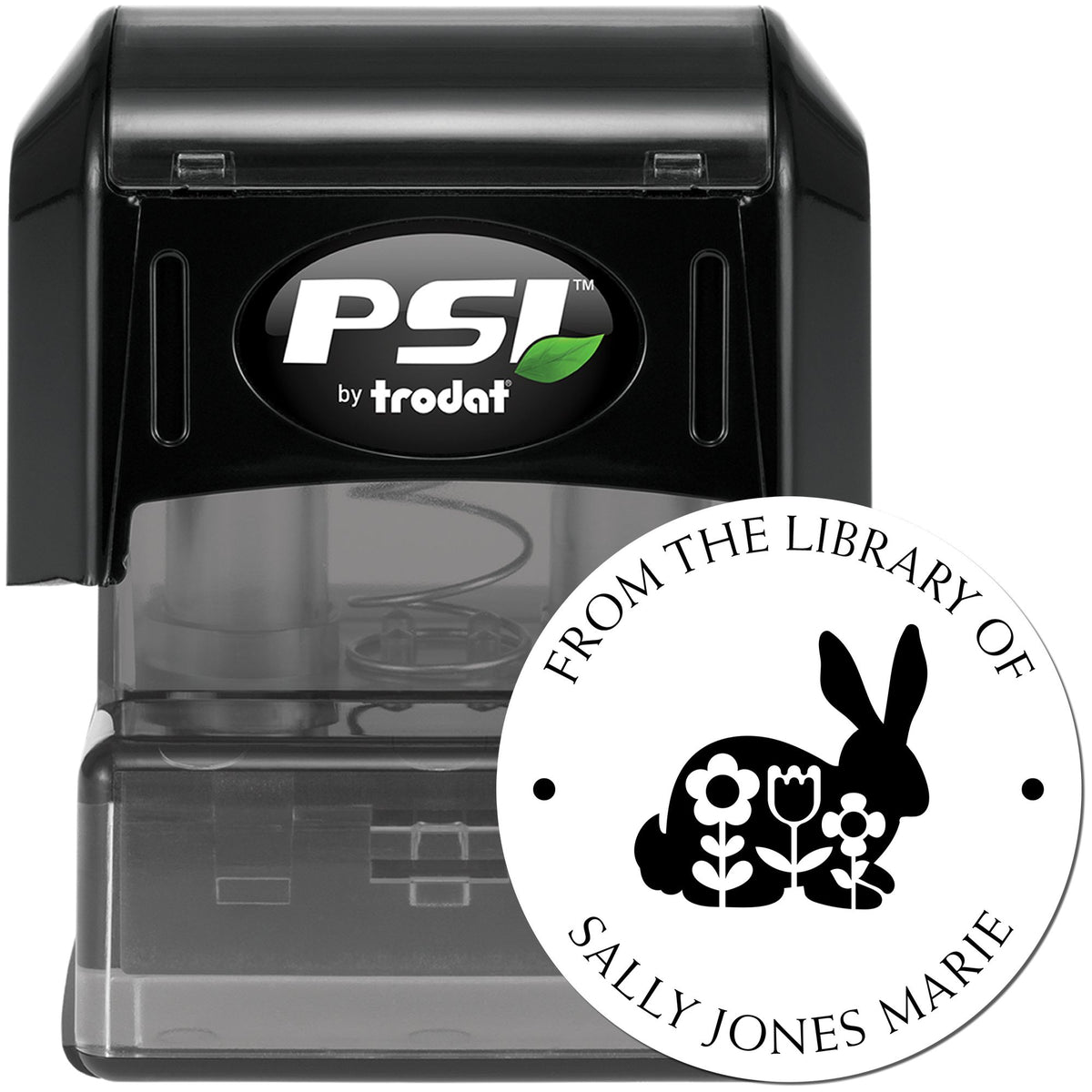 Black PSI by Trodat self-inking stamp with clear library seal, white circle, rabbit and floral design.