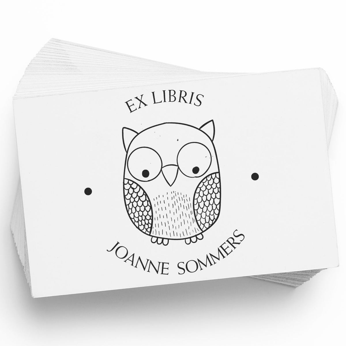 Stack of white ex libris stamp cards with a black owl seal and Joanne Sommers text