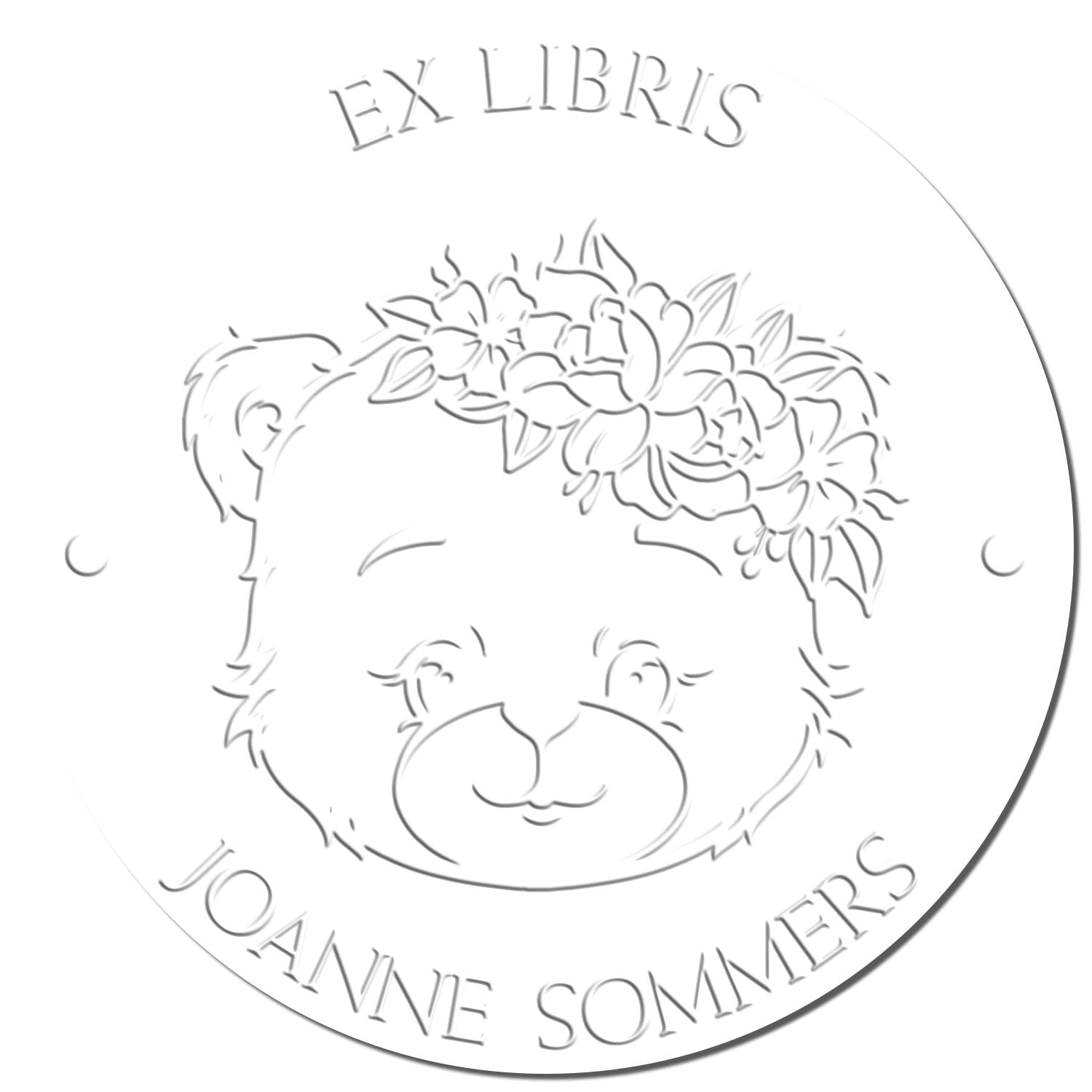 Round white embossing seal stamp with a bear face and floral crown, labeled EX LIBRIS and Joanne Sommers.
