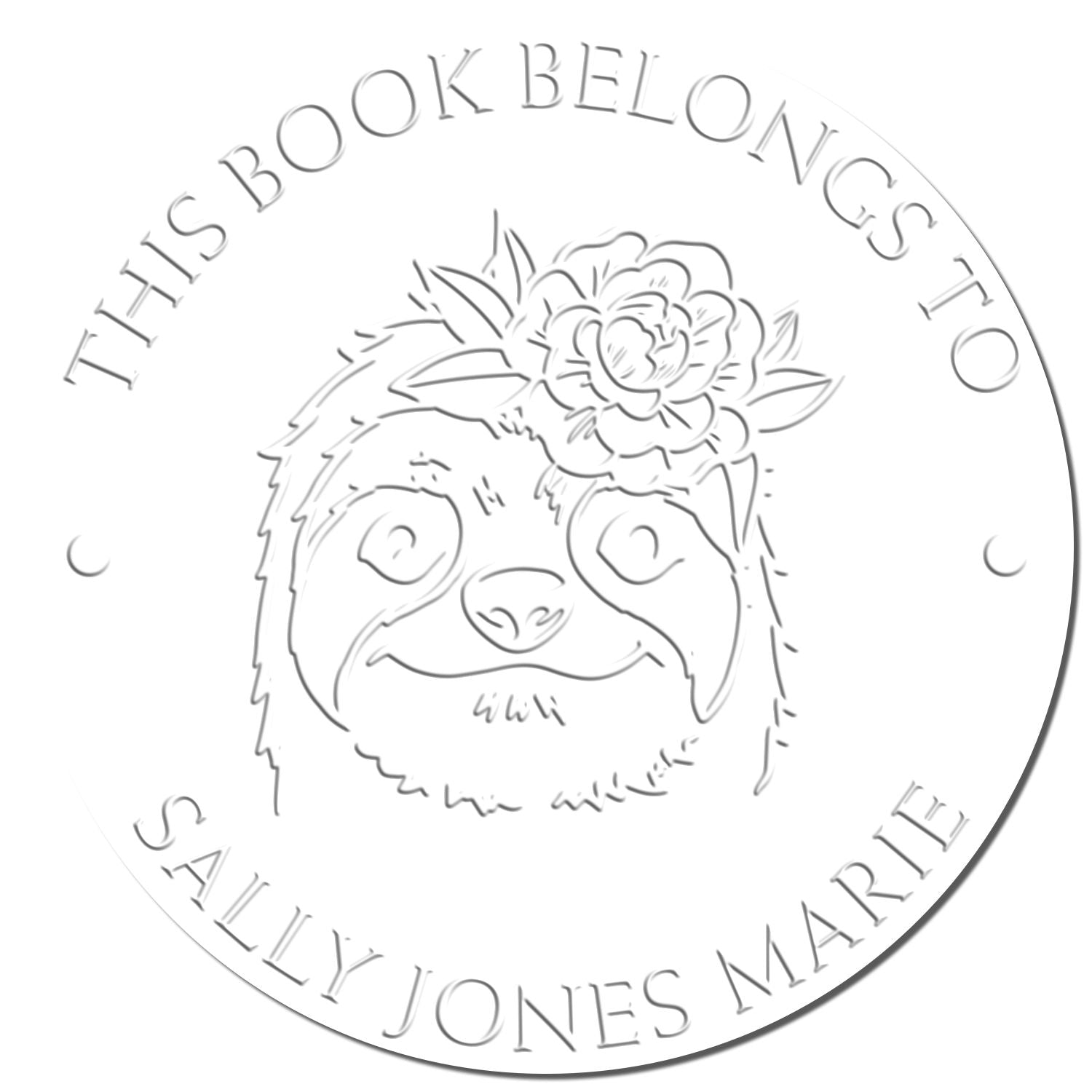 White circular book stamp seal with embossed sloth and flower, reading This Book Belongs to Sally Jones Marie.