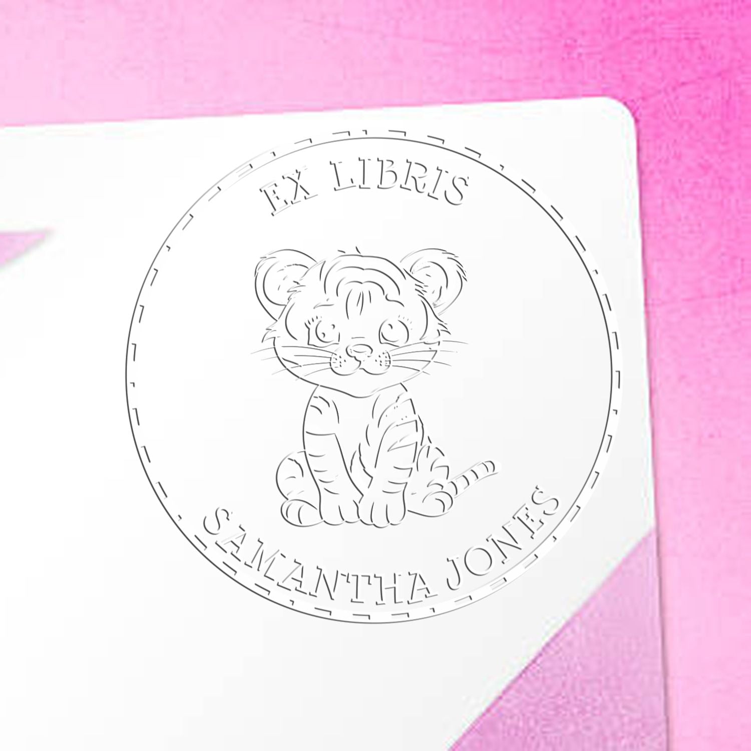 White circular ex libris stamp seal with tiger cub and Samantha Jones text on a pink background
