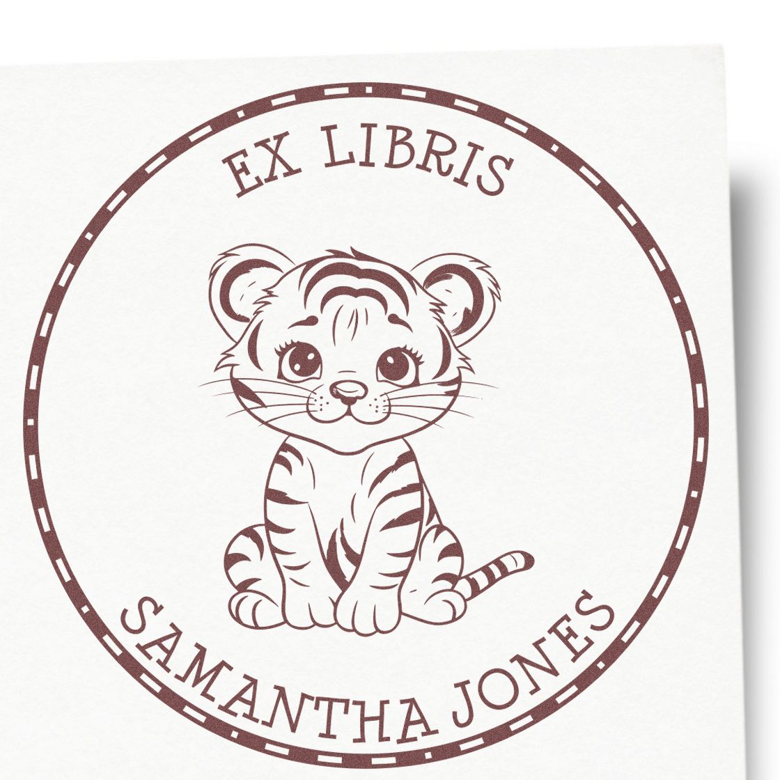 Brown circular ex libris stamp seal featuring a cute tiger cub and Samantha Jones text.