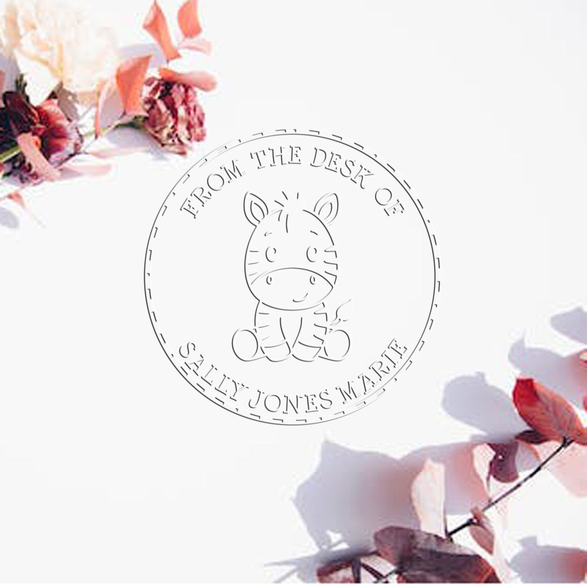 Shiny animal stamp features a soft baby zebra design, used for customizing books with embossed "This Book Belongs To" text.