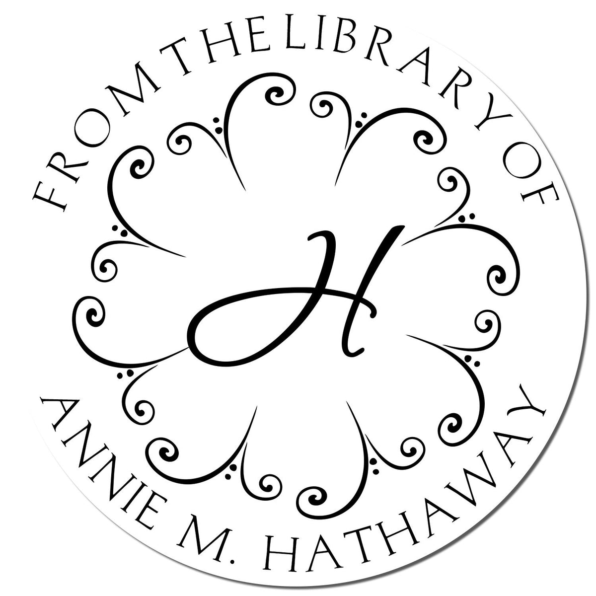 Black-and-white circular library stamp seal with ornate monogram H and text From the library of Annie M. Hathaway.