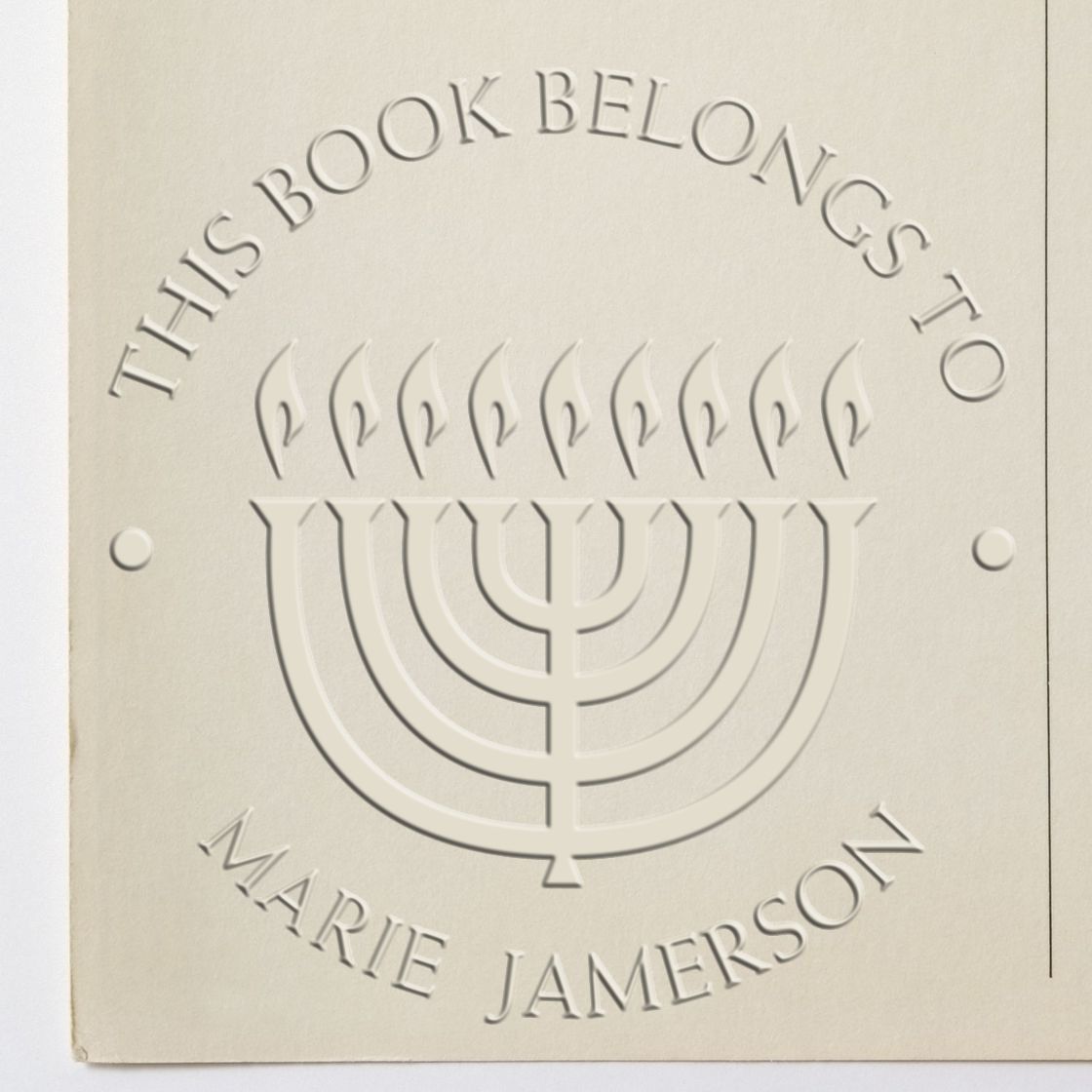Shiny Soft Bright Menorah custom envelope seal stamp in use, featuring a religious menorah design on a circular stamp.