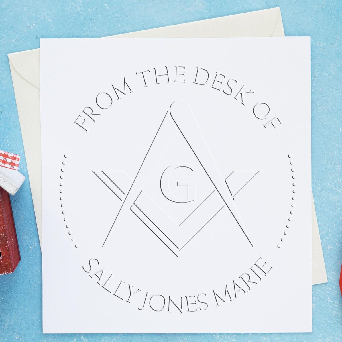 Shiny soft fraternal Masons personalized library collection paper embosser with Masonic stamps in use, featuring intricate seal design.