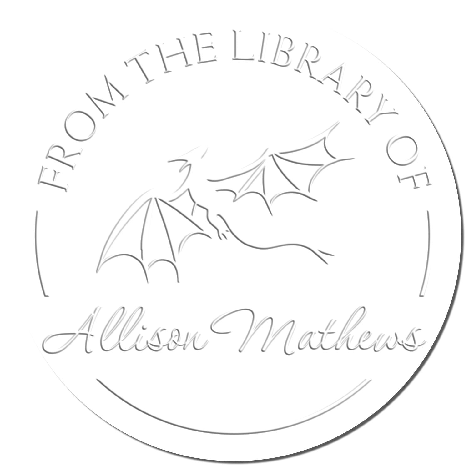 White circular library stamp seal with silver-gray dragon line art and text From the Library of Allison Mathews.