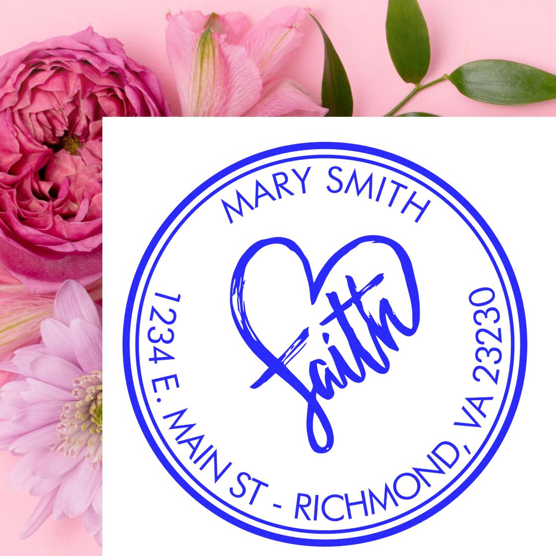 Blue circular custom stamp seal reading Mary Smith with heart and Faith, on a pink floral background.