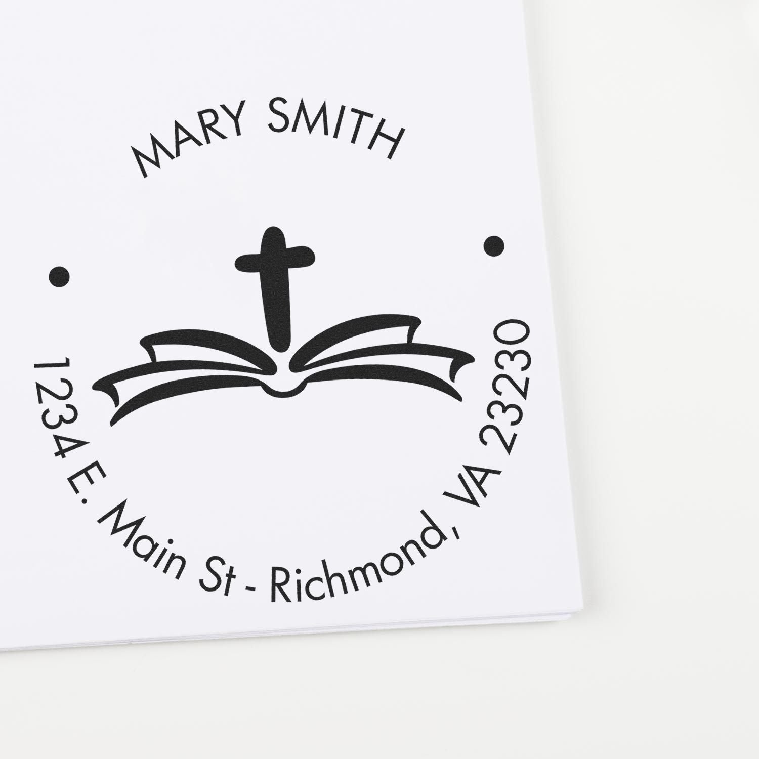 Black custom church stamp seal with cross and open Bible, reading Mary Smith and 1234 E. Main St., Richmond, VA.