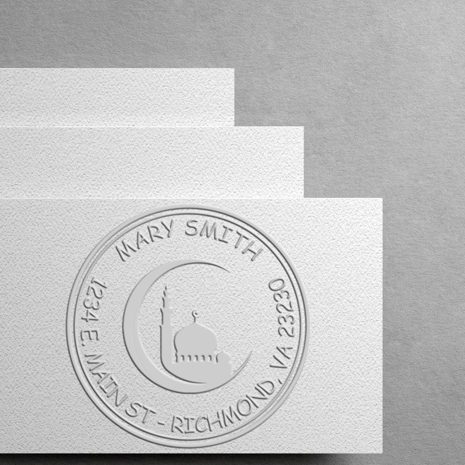 Embossed silver stamp seal on textured white paper, with a circular Mary Smith emblem on layered gray and white cards.