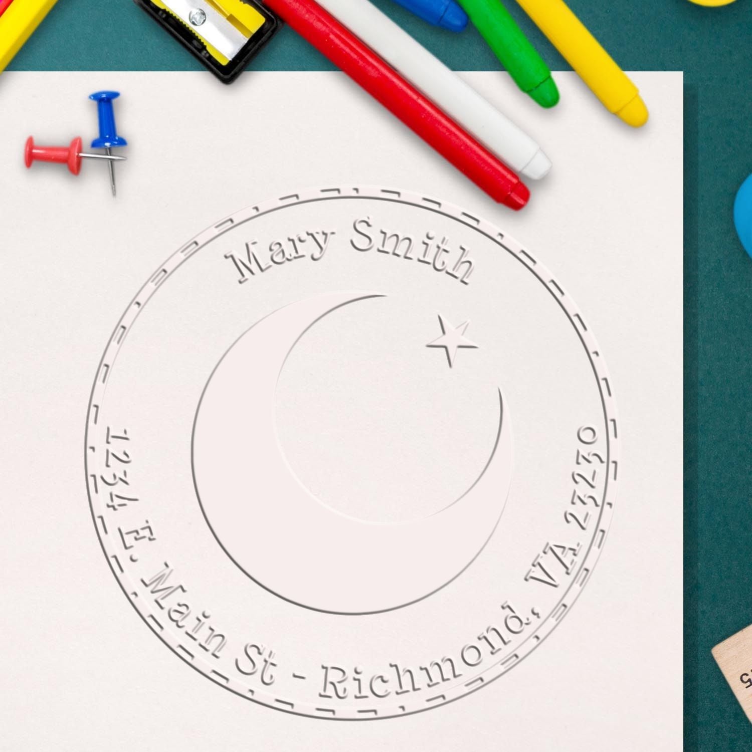 Custom embossed seal stamp for Mary Smith on white paper, with colorful pens and pushpins.