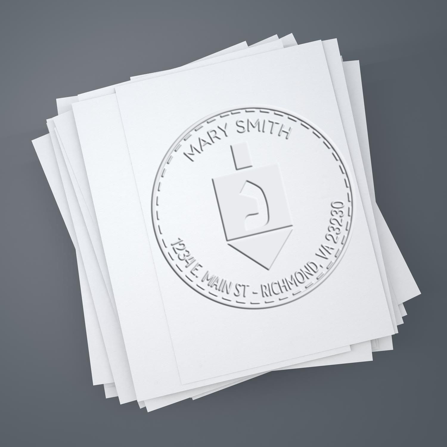 Embossed custom seal stamp on stacked white papers, with circular Mary Smith seal impression on a gray background.