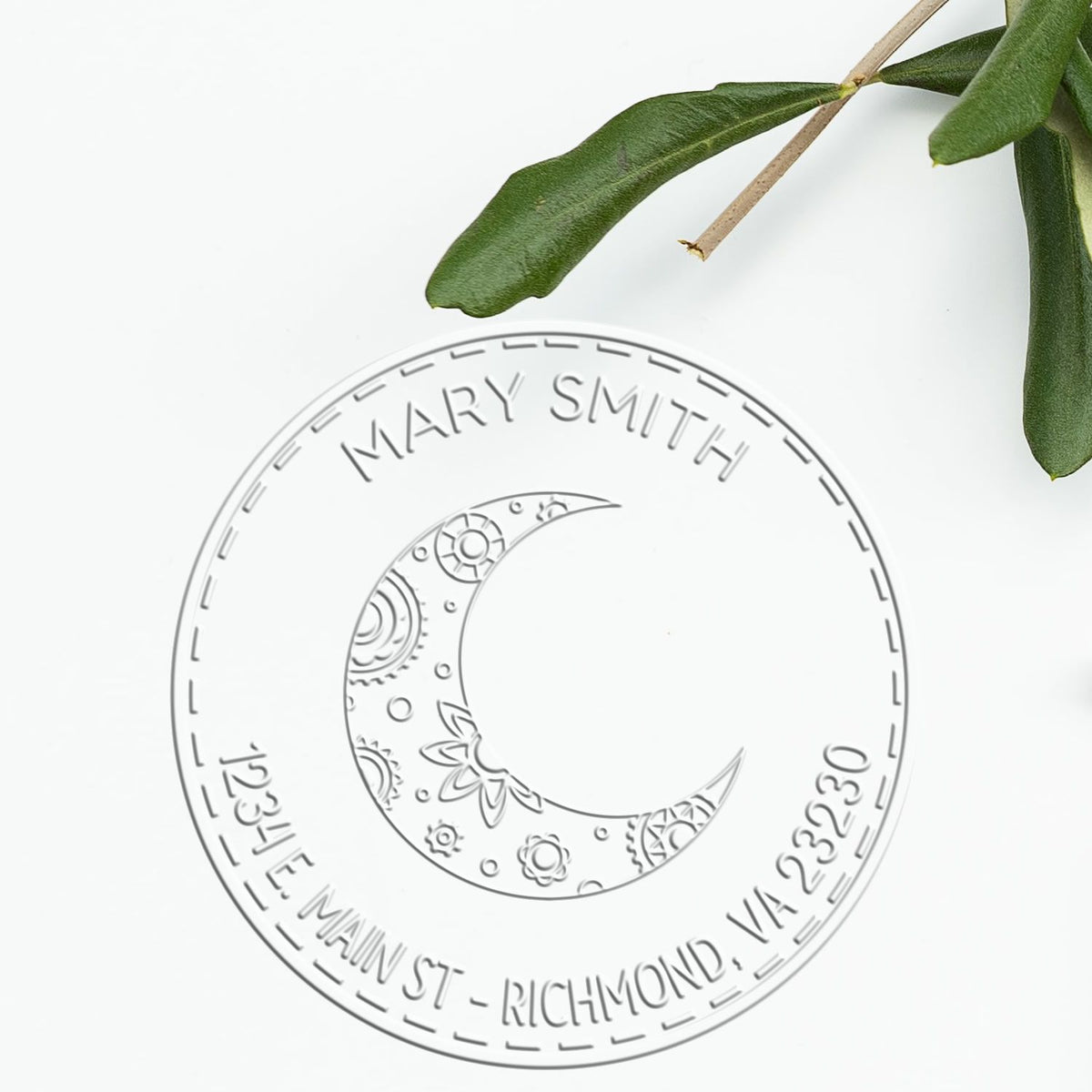Shiny Soft Ethereal Moon personalized envelope embossing seal with astrological moon design in use on a letter.