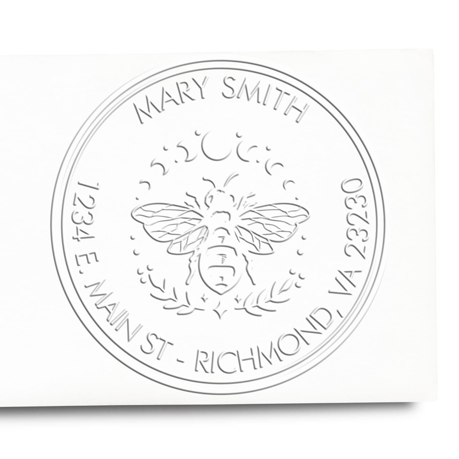 Silver embossed round bee seal stamp with Mary Smith and Main St, Richmond, VA 23230 on white background