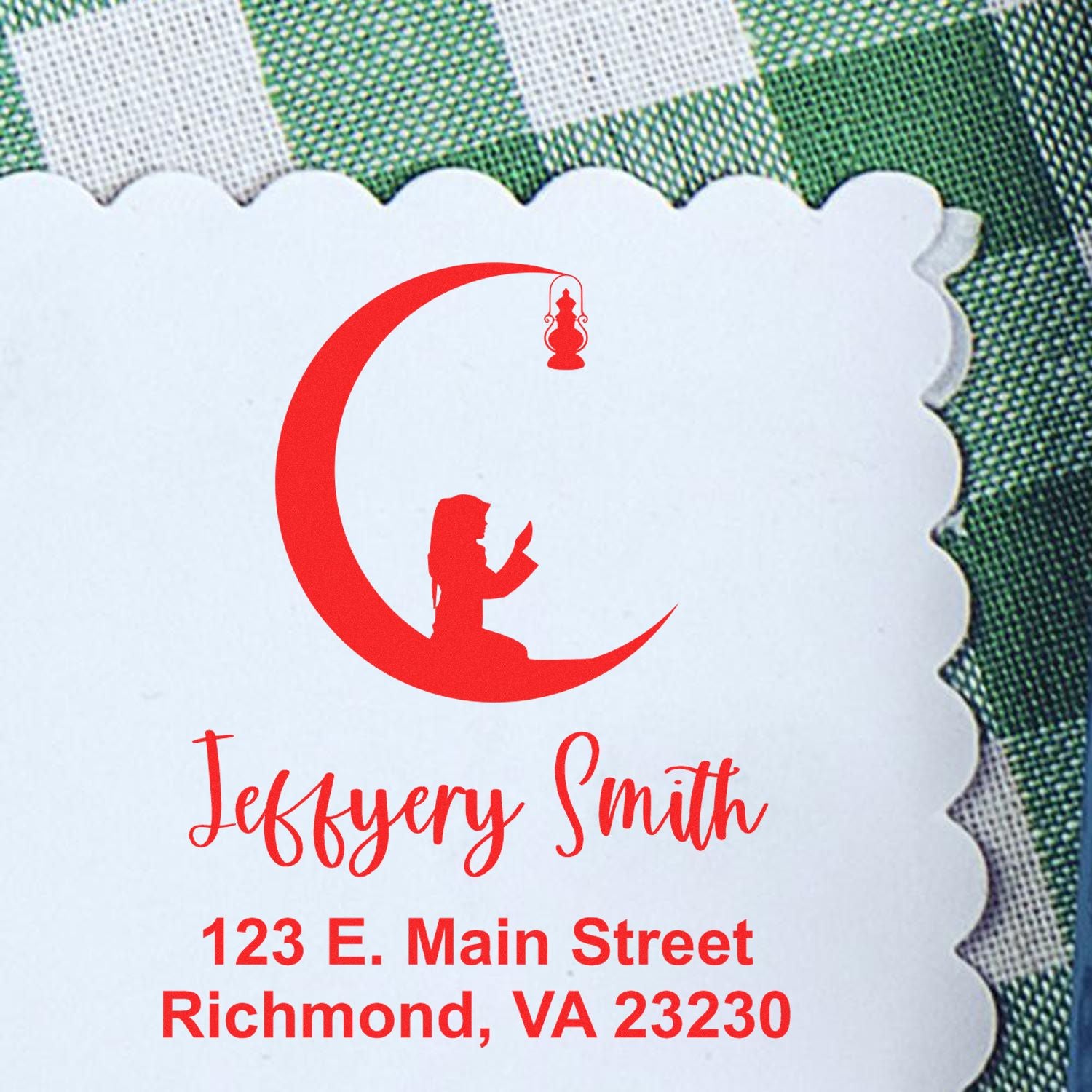 Red custom stamp and seal on scalloped white paper, featuring a crescent logo, woman silhouette, and address text.