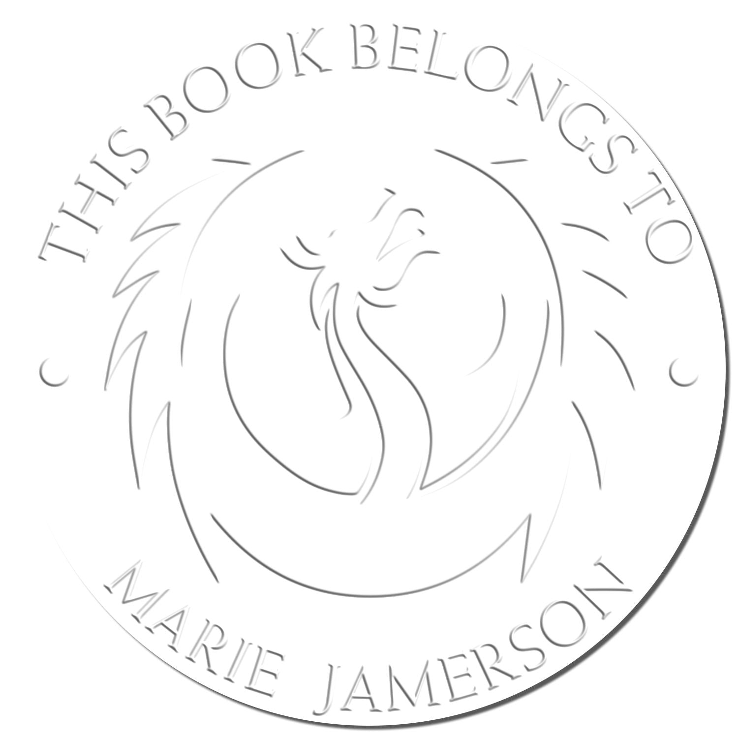 Round gray embossed book stamp seal with floral center and This Book Belongs to Marie Jamerson on white background