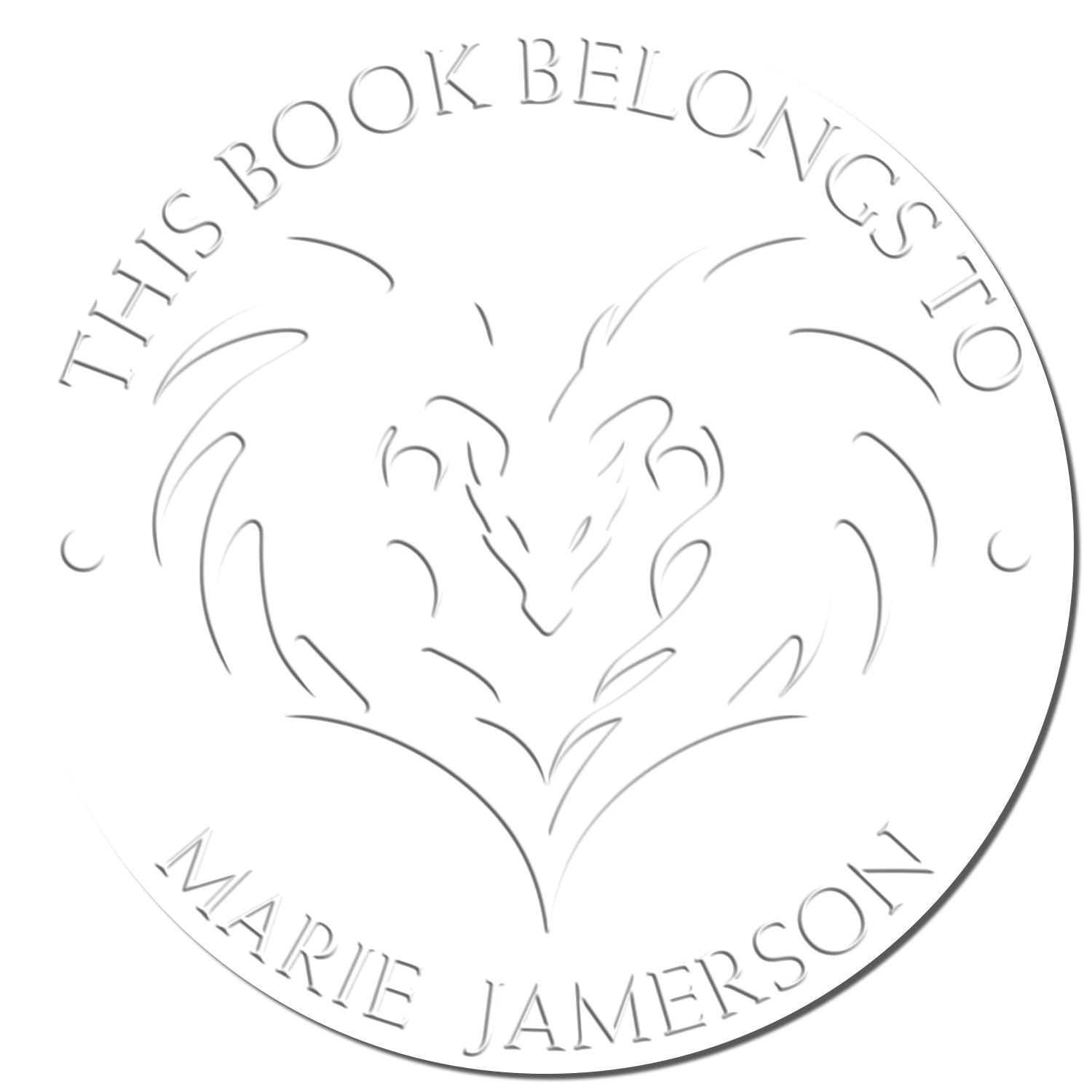 Circular gray embossing stamp seal with heart design and text, This Book Belongs to Marie Jamerson.