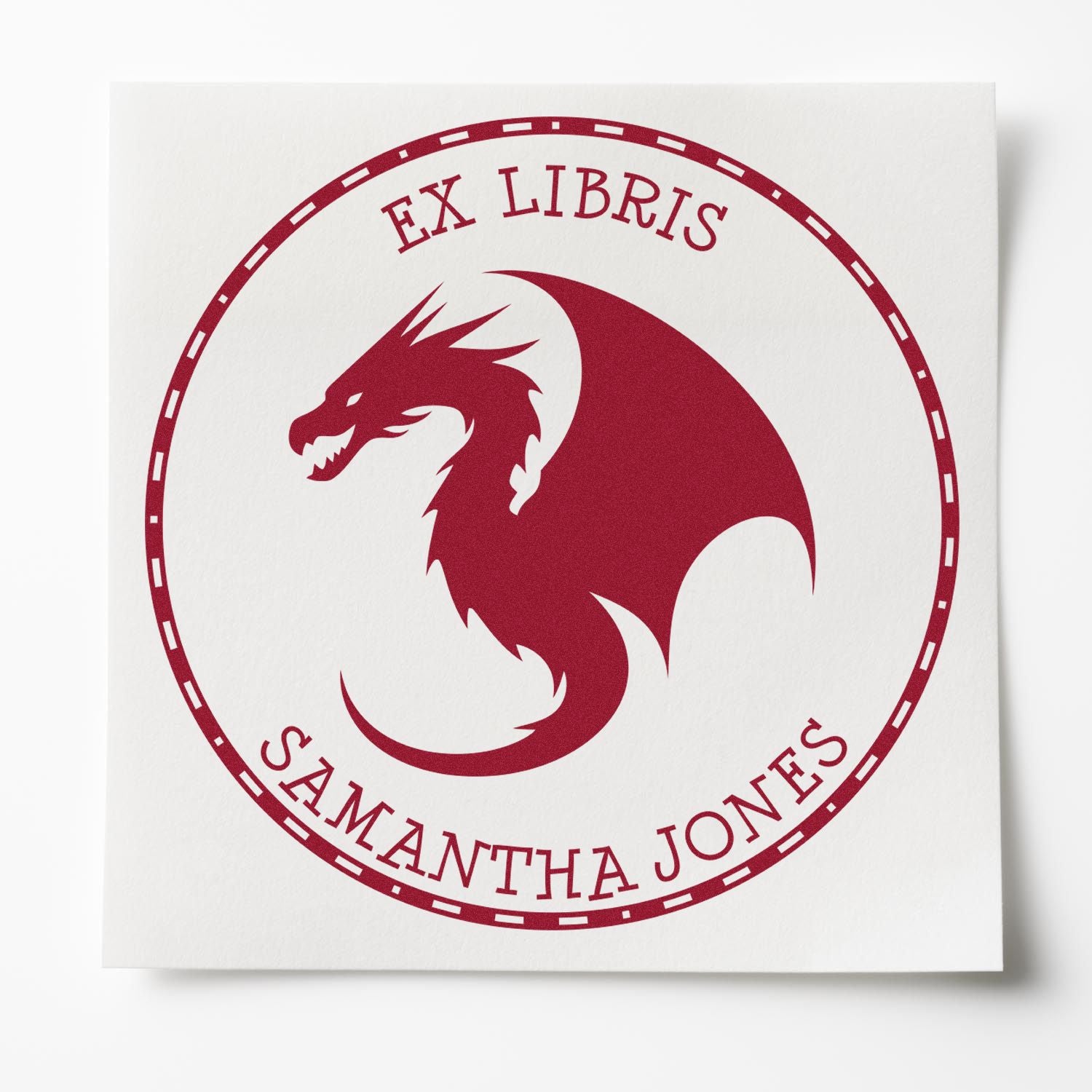 Red ex libris stamp seal with burgundy dragon emblem and circular border, labeled Samantha Jones on white paper.