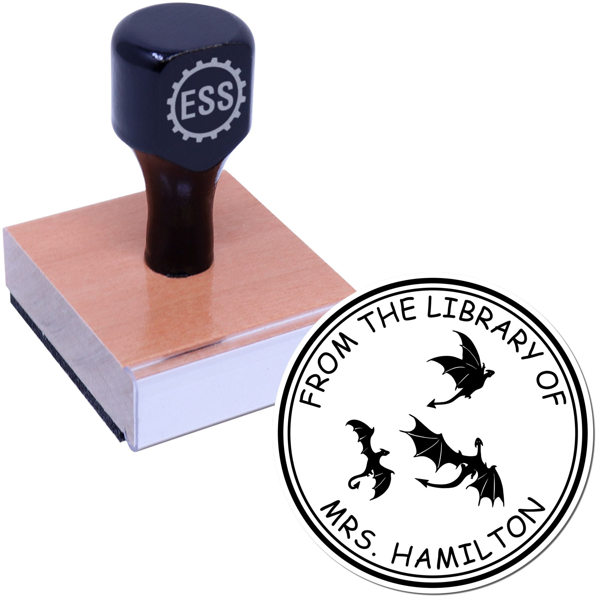 Dark blue self-inking stamp on wooden block beside a black-and-white custom library seal with bats.