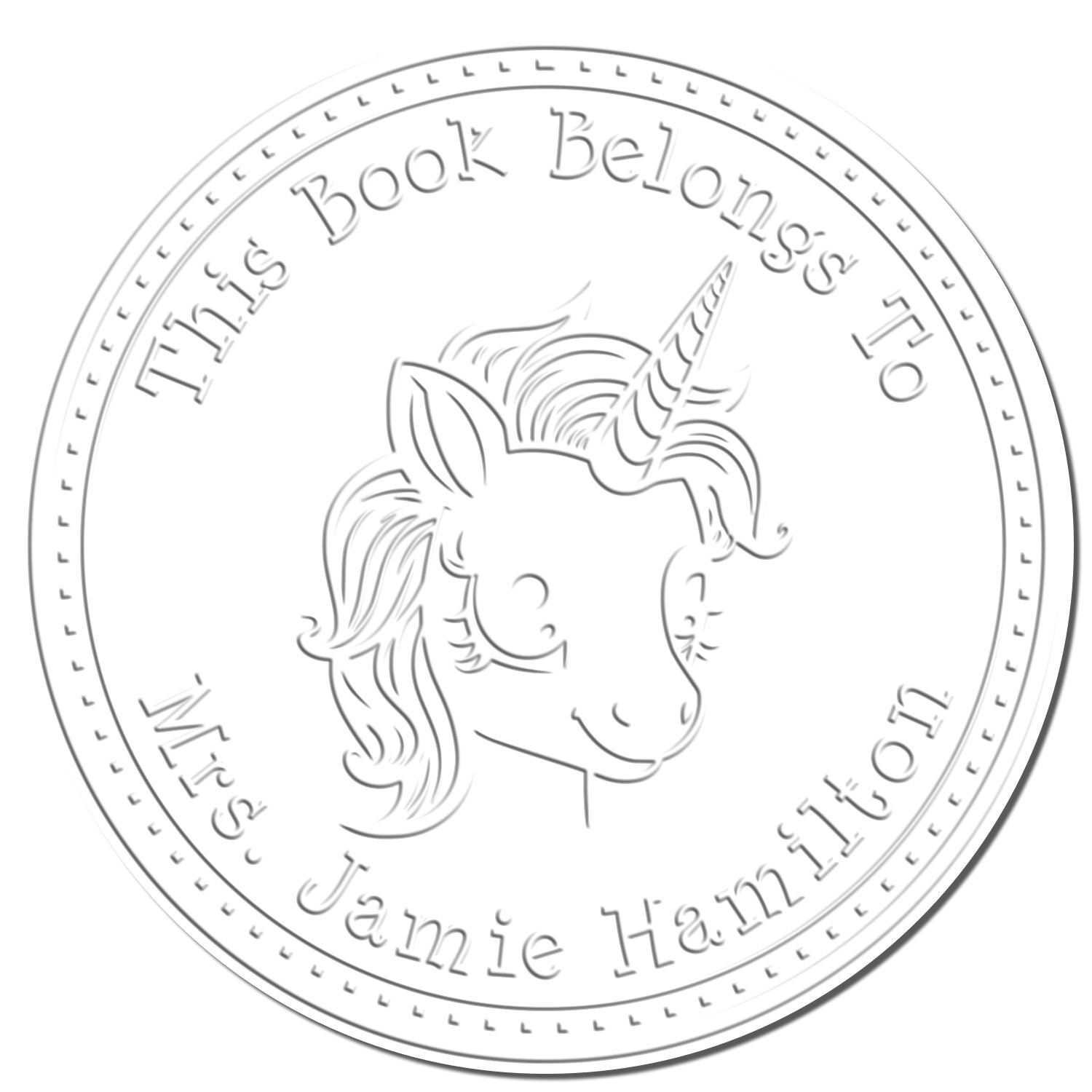 White circular book stamp with unicorn seal and gray text: This Book Belongs To Mrs. Jamie Hamilton.