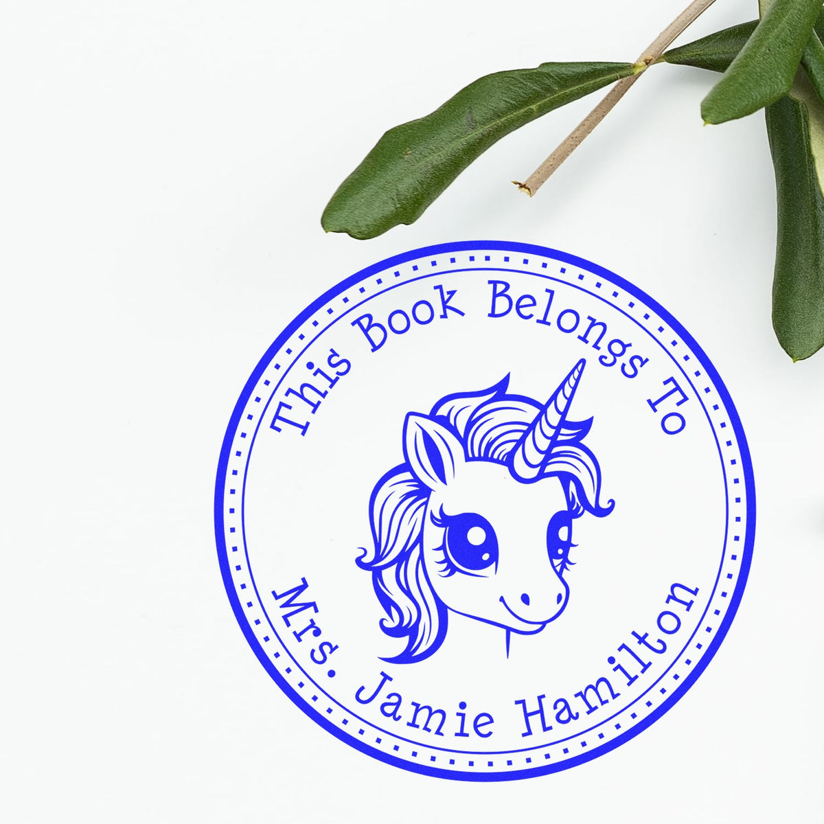 Blue unicorn book-belongs-to stamp seal for Mrs. Jamie Hamilton on white background with green leaves.