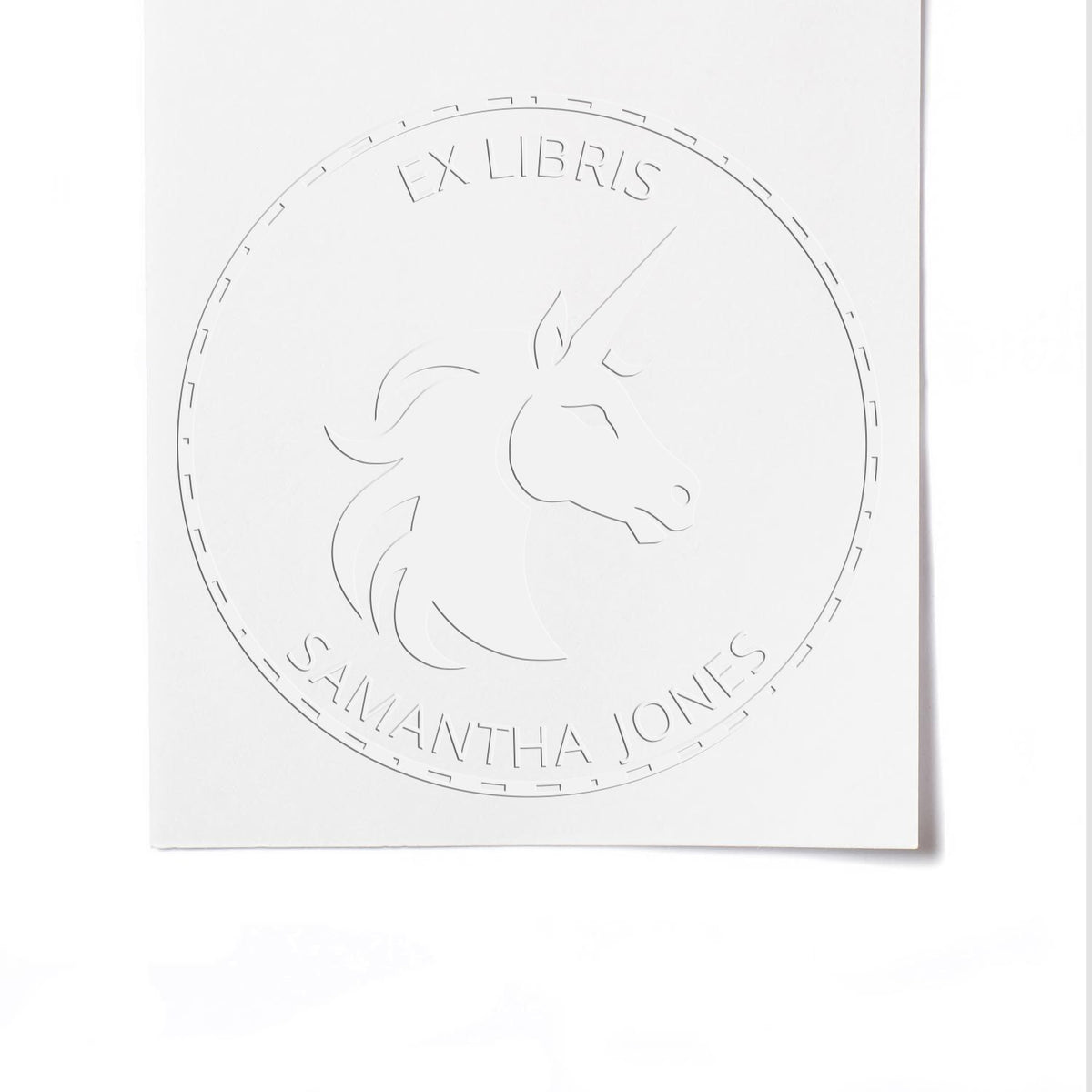 ESS Velvetfrost unicorn handheld fantasy library embossing seal in use, featuring a custom name design on a velvetfrost stamp.