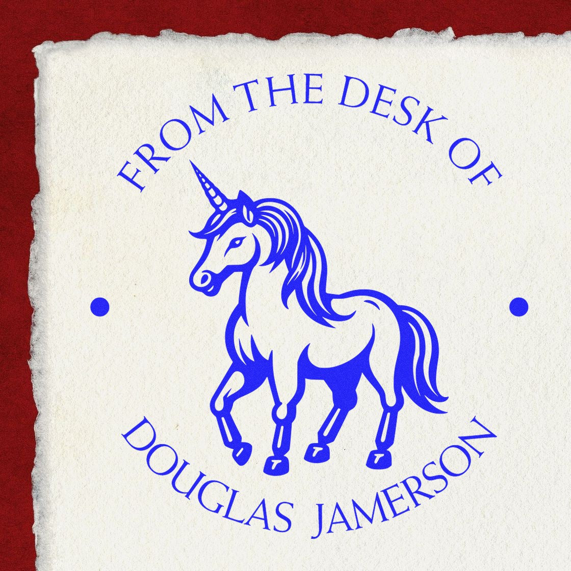 Blue unicorn desk stamp seal on cream torn-edge paper, reading From the Desk of Douglas Jamerson