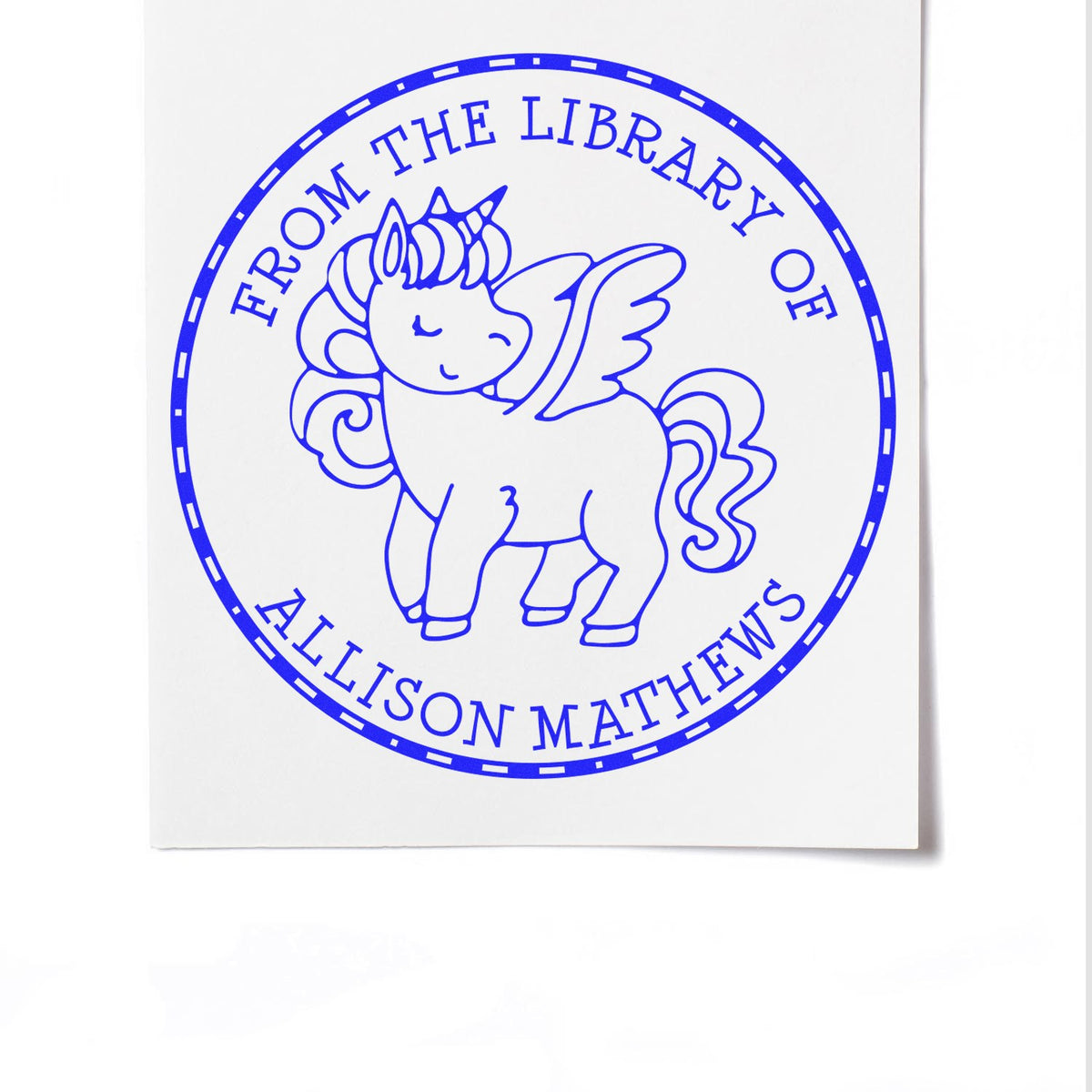 Blue circular library ownership stamp seal with a unicorn and the text From the Library of Allison Mathews.