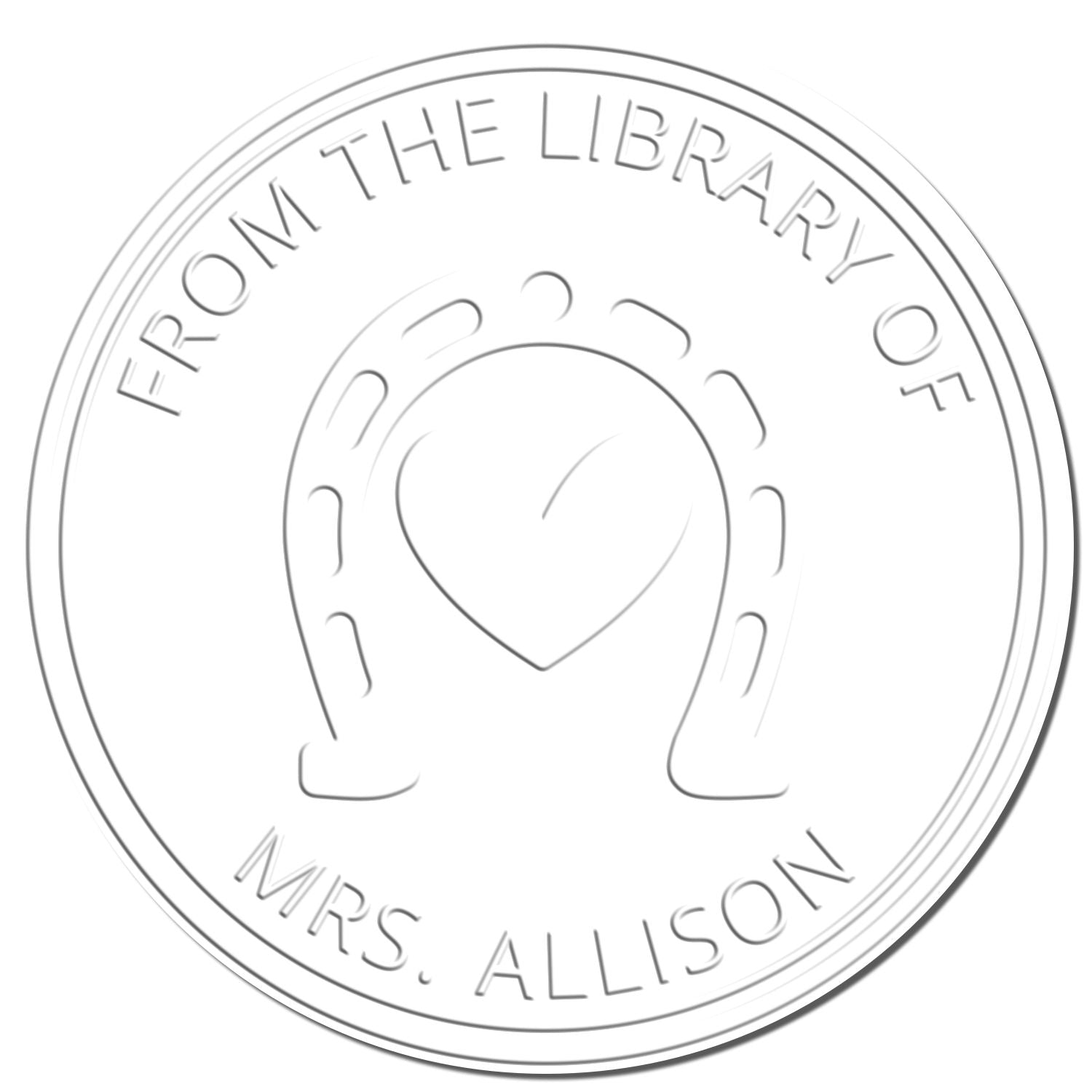 Embossed silver circular library stamp and seal with horseshoe and heart, reading From the Library of Mrs. Allison