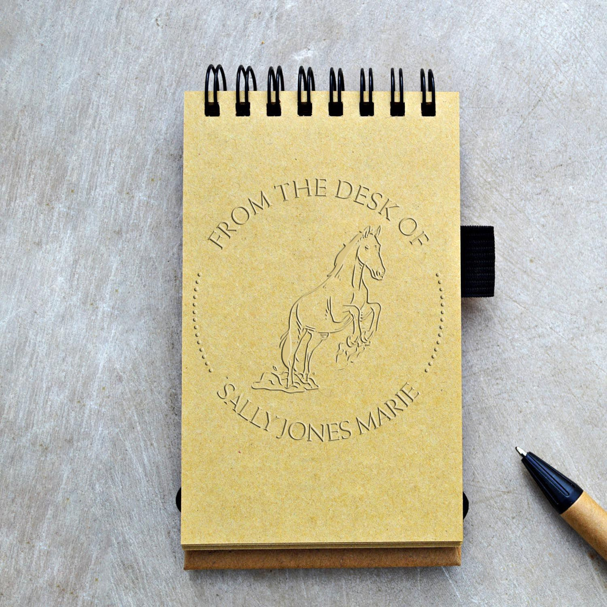 ESS Whispering Shadow Horse handheld embossing seal with farm animal stamp design in use, custom library book belongs to embossing tool.