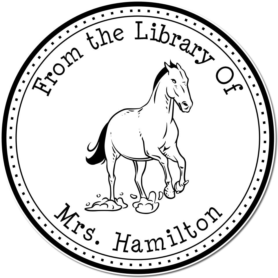 Black-and-white circular library stamp seal with a horse illustration and curved text reading From the Library Of Mrs. Hamilton.