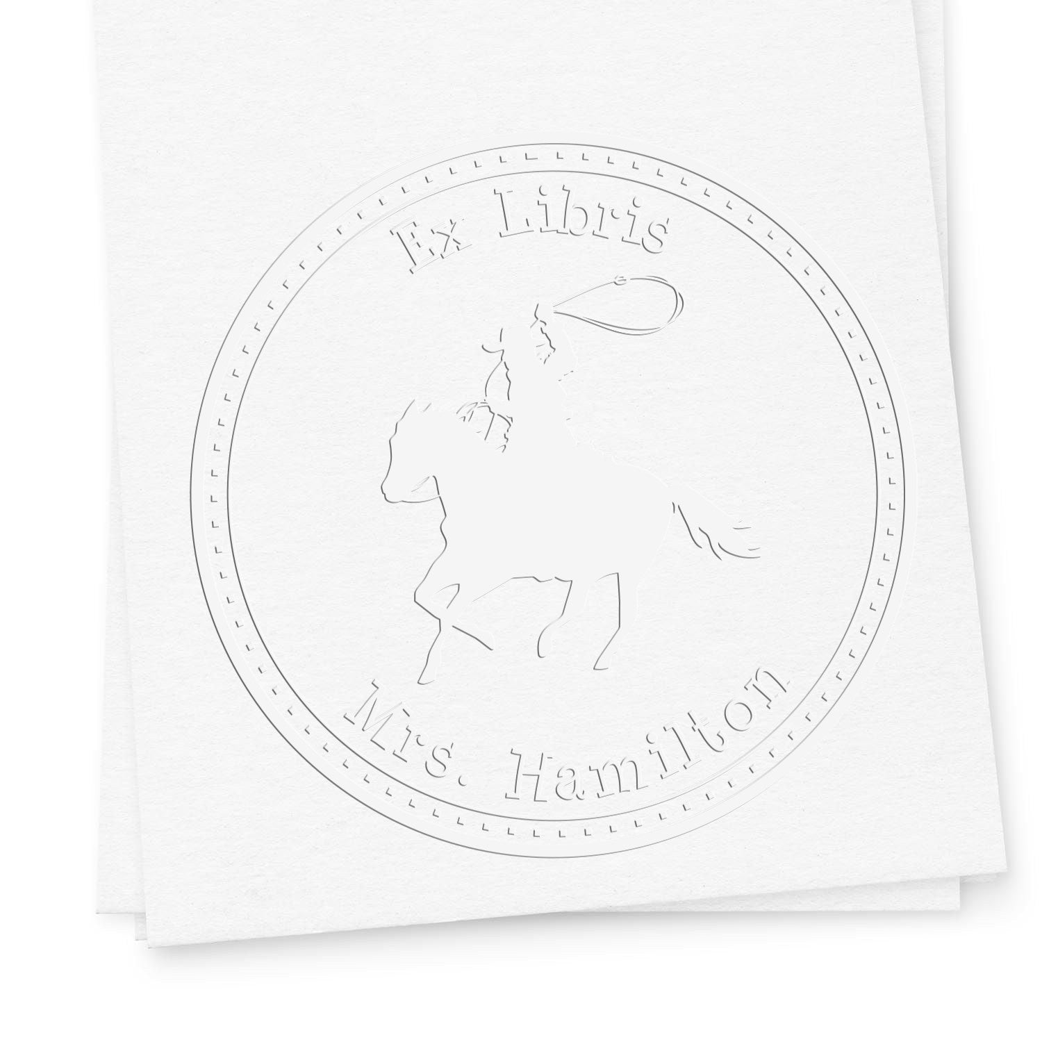White embossed circular stamp seal with horseback rider silhouette and ÂEx Libris Mrs. Hamilton text on paper.