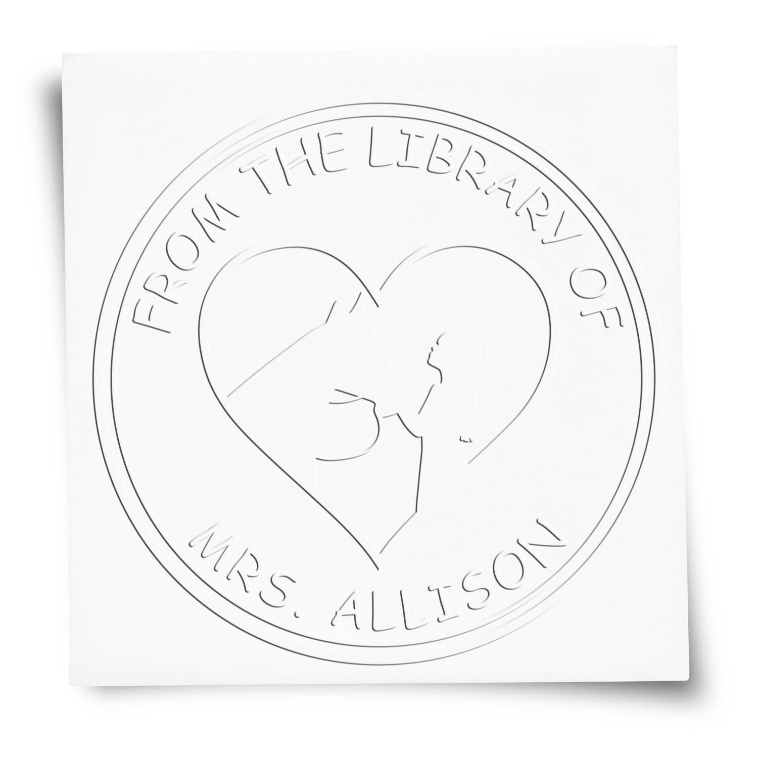 White embossed custom library stamp seal with heart design and text, From the Library of Mrs. Allison.