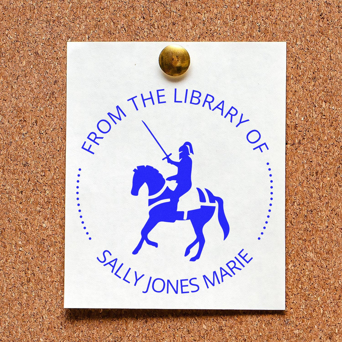 White library stamp seal card pinned to corkboard, blue knight on horseback and circular text with Sally Jones Marie.