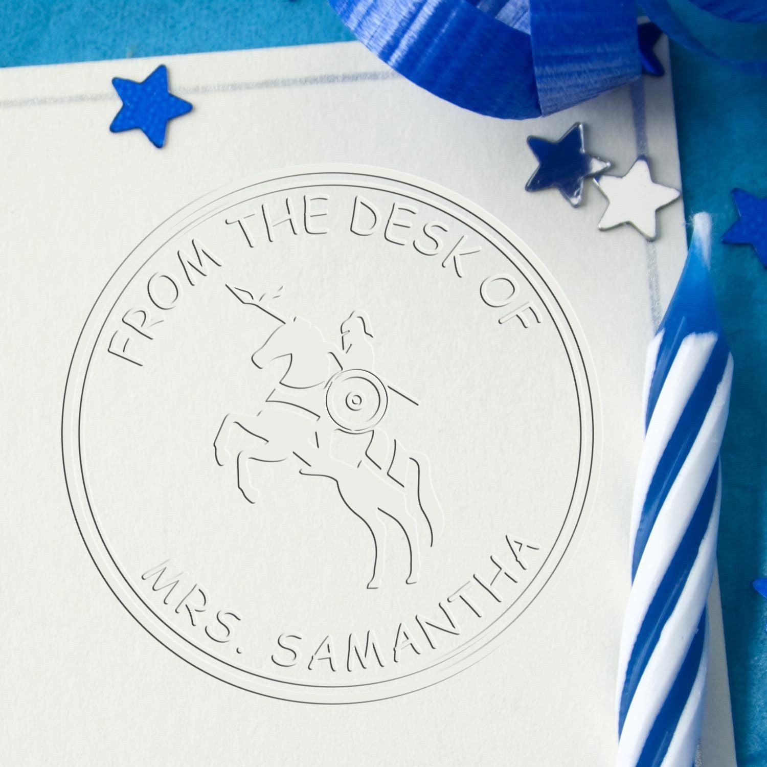 Embossed white circular stamp seal with horse rider, blue stars, and blue ribbon accents, labeled Mrs. Samantha.