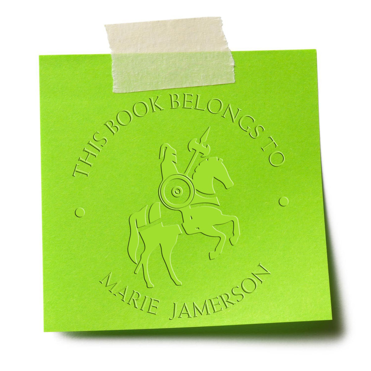 Bright green embossed book ownership stamp with horse-and-rider seal, taped at top, reading This Book Belongs to Marie Jamerson