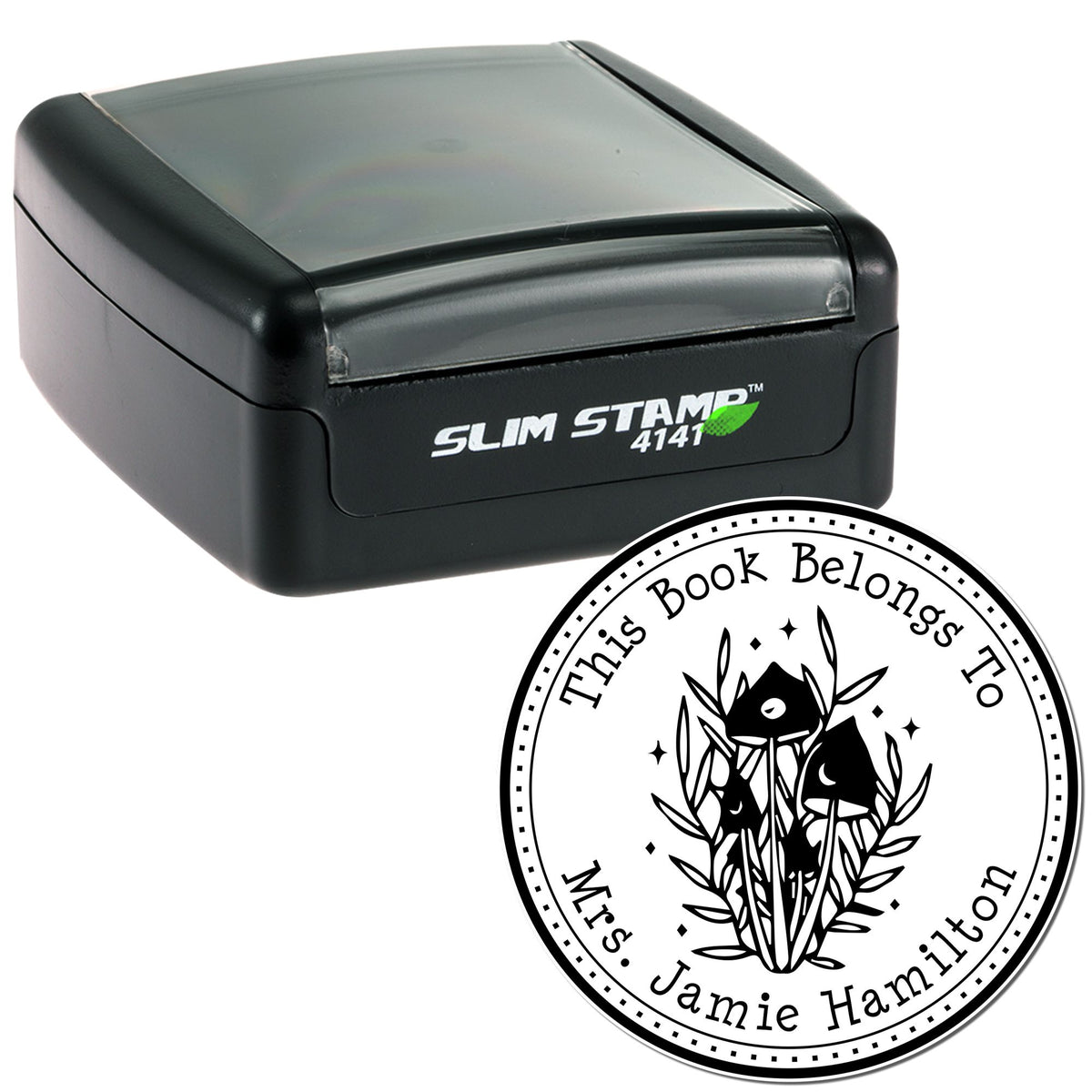 Black Slim Stamp 4141 self-inking stamp with clear cover beside round custom book seal featuring a black floral cat design.