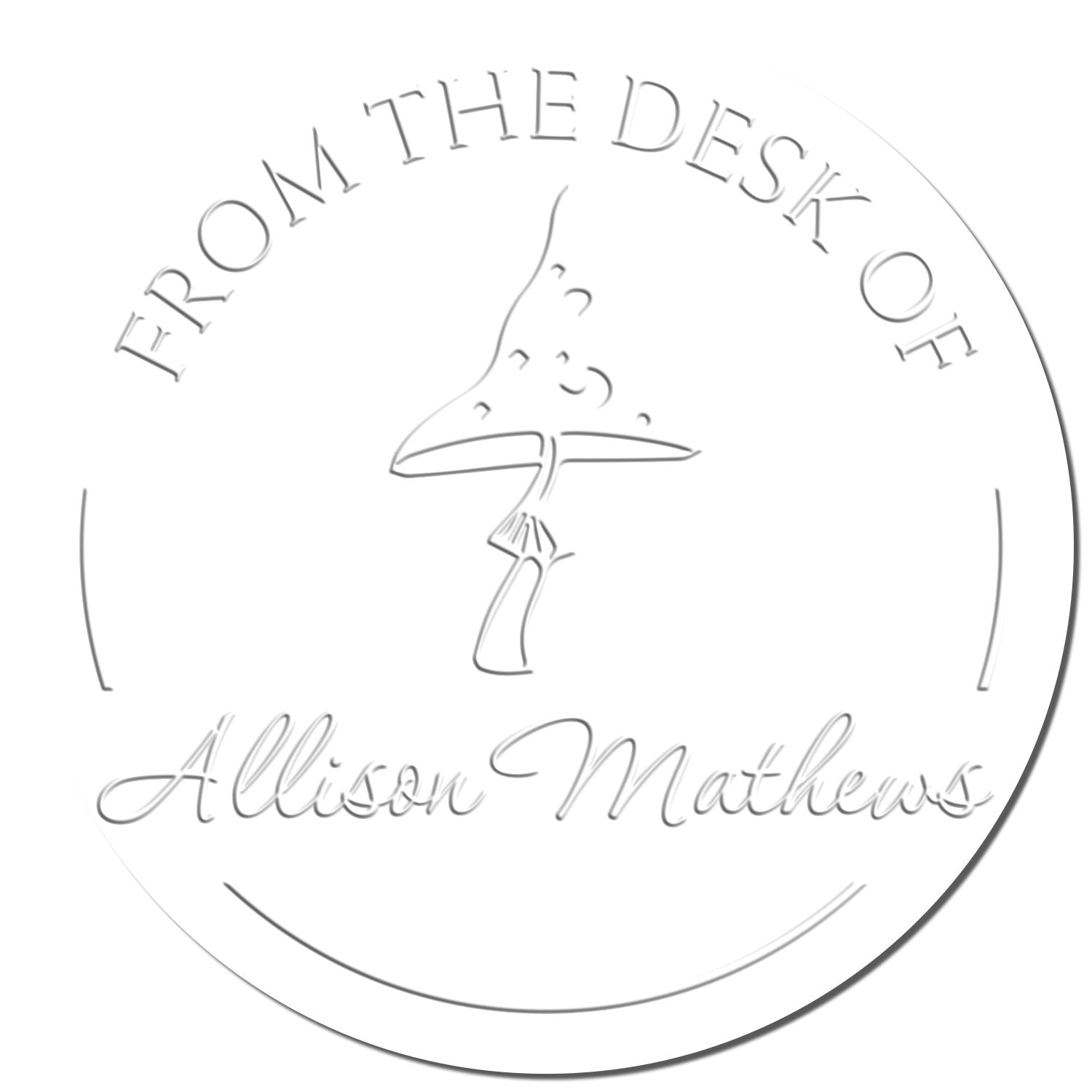 White embossed circular desk seal stamp with gray lettering, fountain pen nib icon, and From the Desk of Allison Mathews.