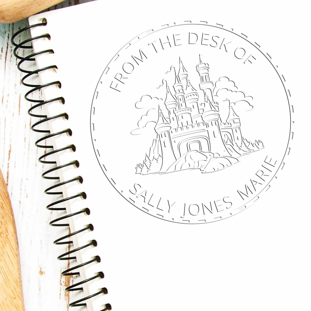 Trodat Stonegate Citadel Castle hybrid fantasy stamp in use, featuring detailed embossed castle design for custom book embossing.
