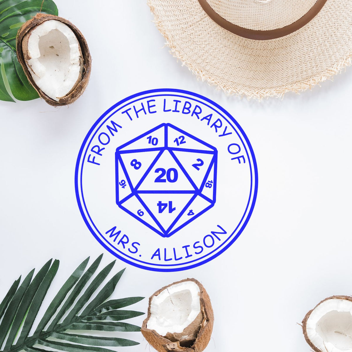 Blue personalized library stamp seal with D20 dice design, surrounded by coconuts, green leaves, and a straw hat on white.
