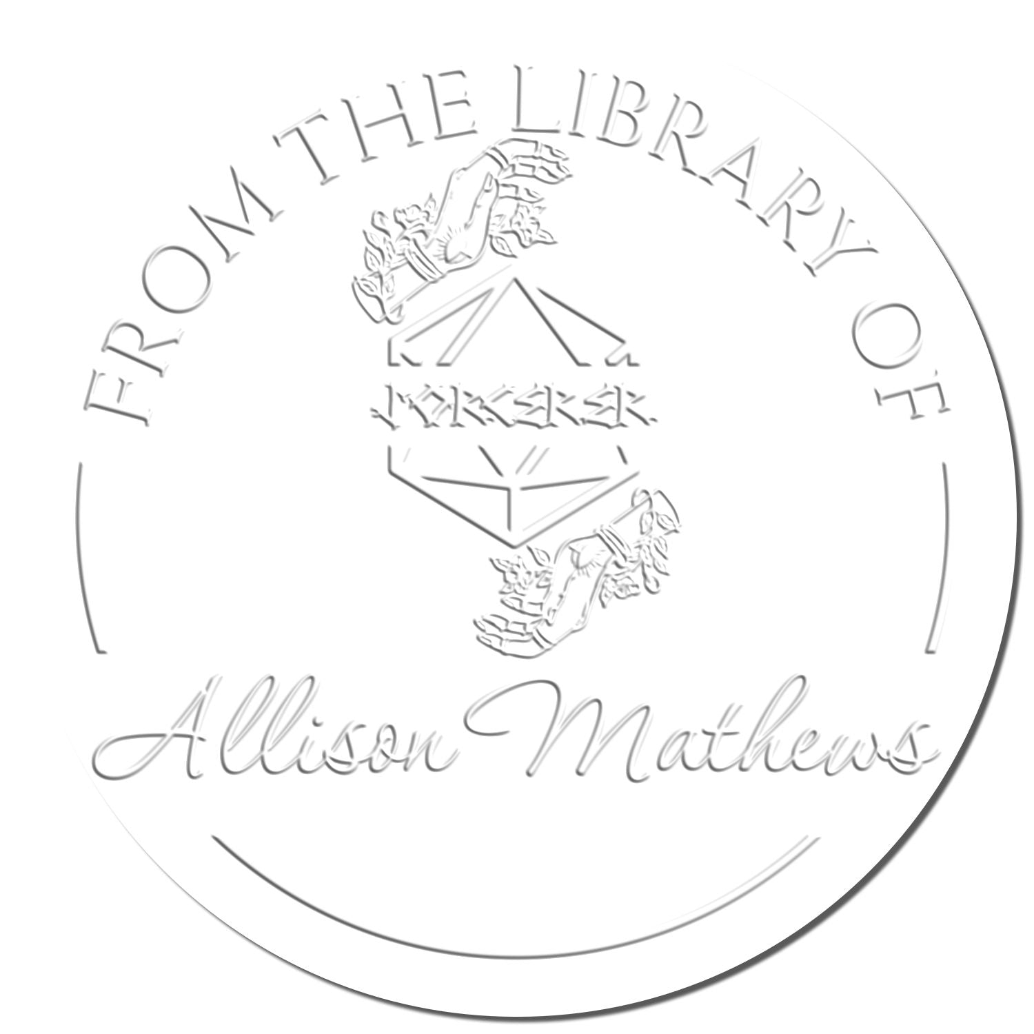 White embossed circular library seal stamp with silver-gray text From the Library of and Alison Mathews.