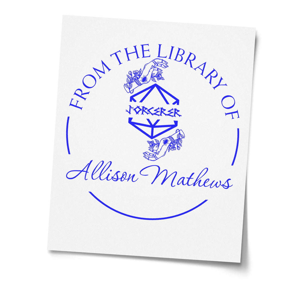 Blue custom library book stamp seal on white paper with circular text, hands graphic, and Allison Mathews name.