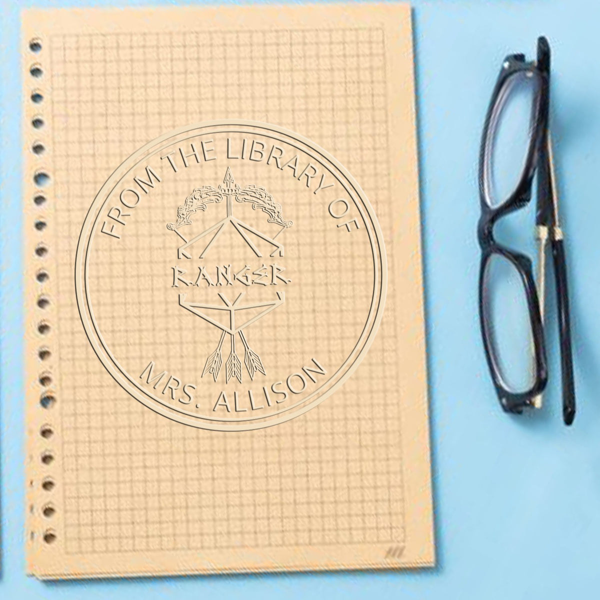 Trodat Wings of Flying Gamer Hybrid customized embossing seal used with fantasy stamp for book identification.